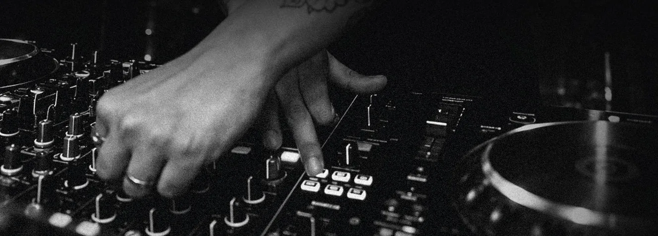 Black and white close-up of Scott Jordan's hands on the mixer